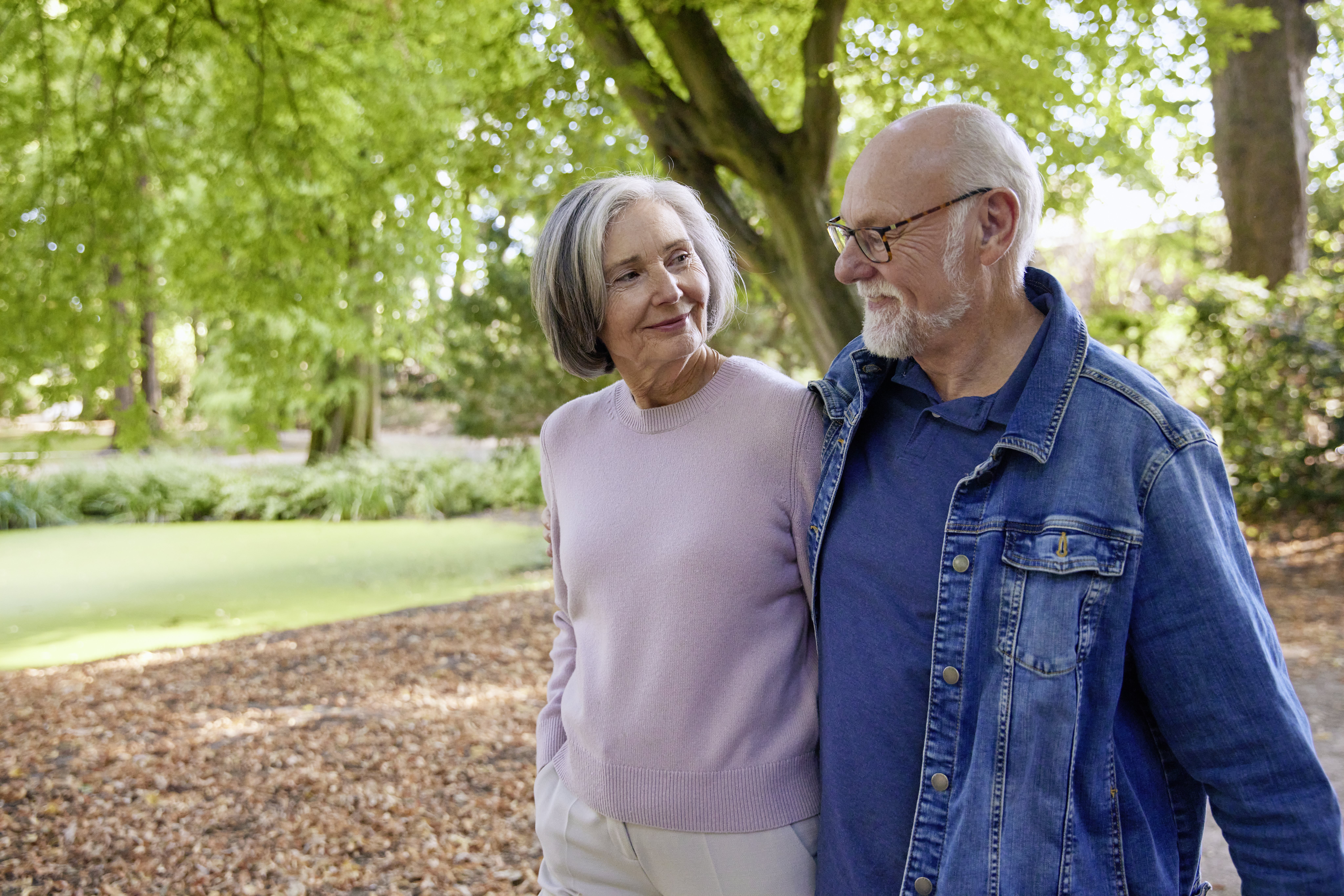 elderly couple under tree