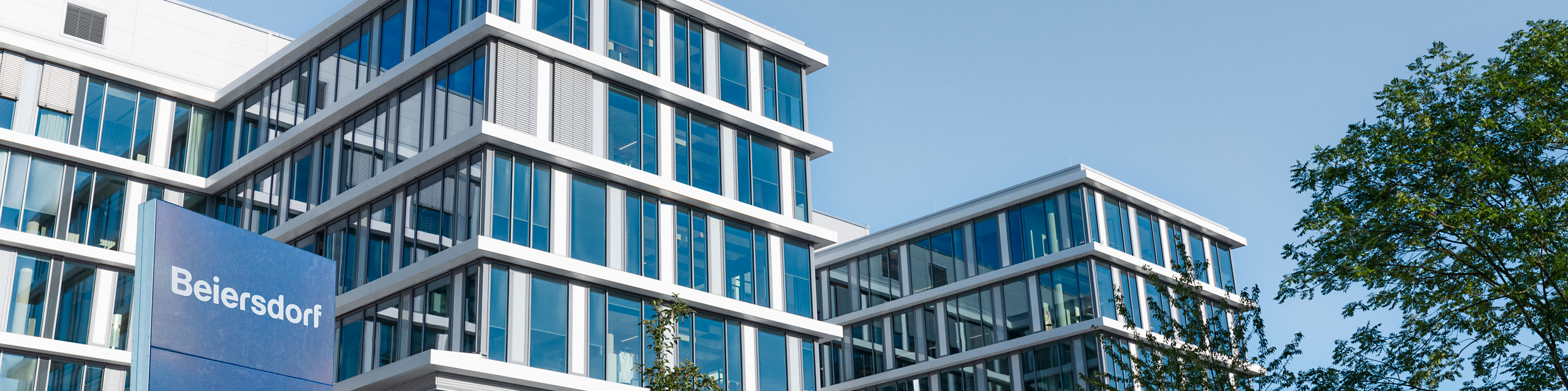 Beiersdorf headquarters building with flag