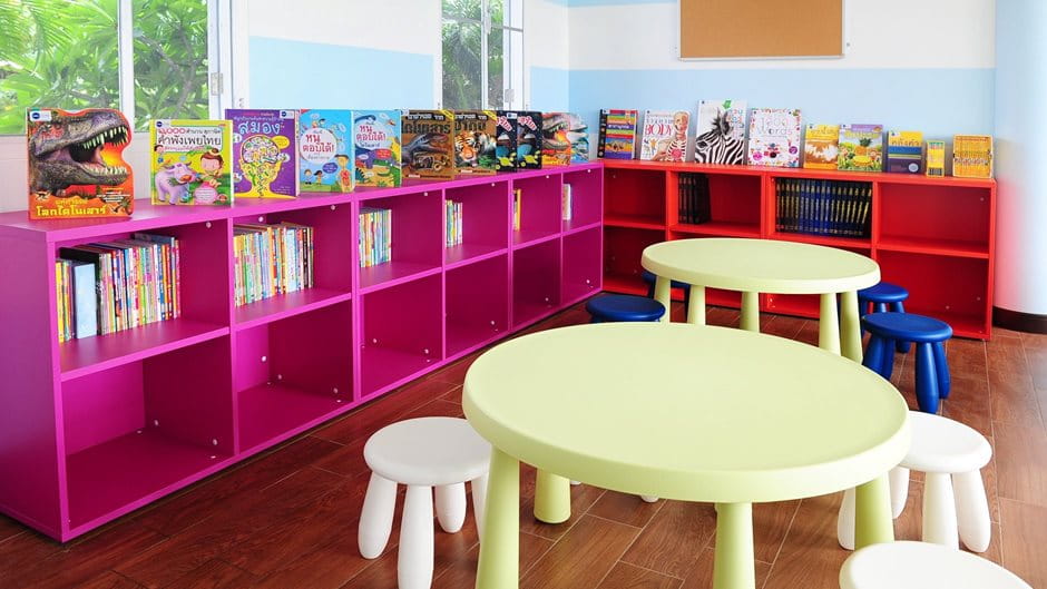 library with colorful chairs, tables and children books