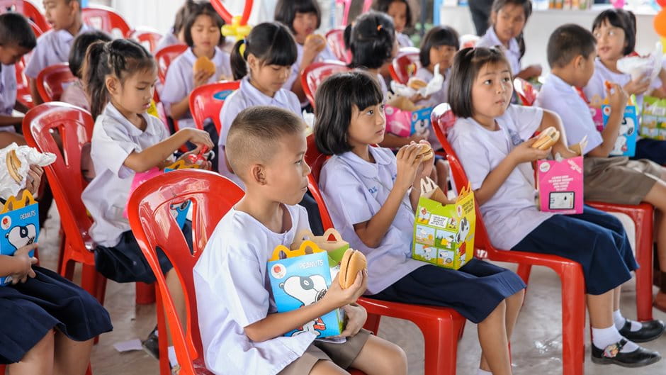 Children sitting on the chairs