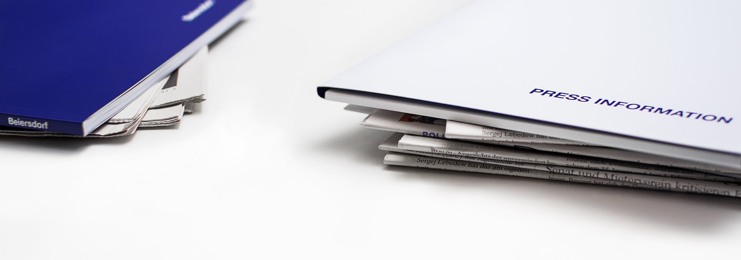 Newspaper and press maps on a table