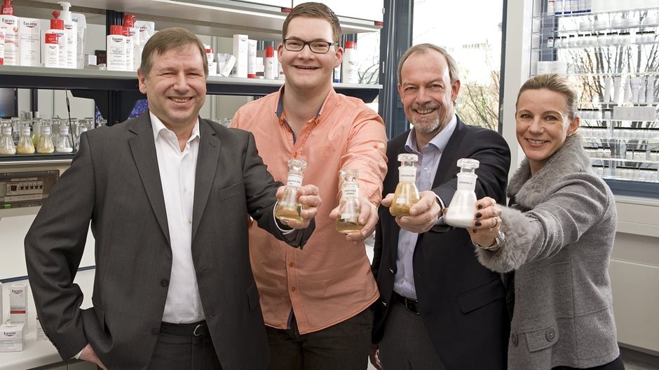 employees of the research department hold test tubes