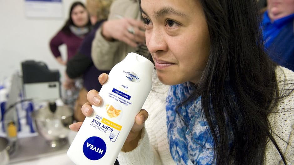 test subject smelling a NIVEA product