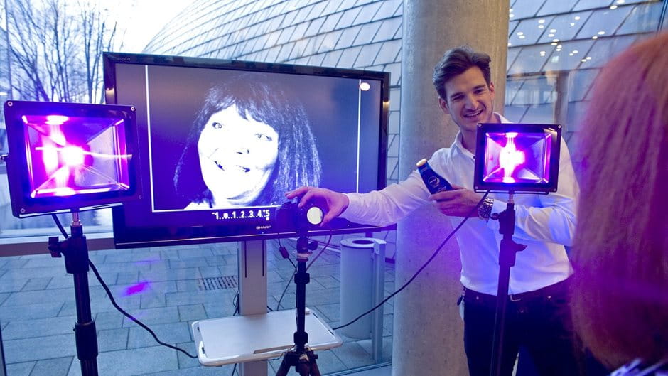employee explaining the UV camera