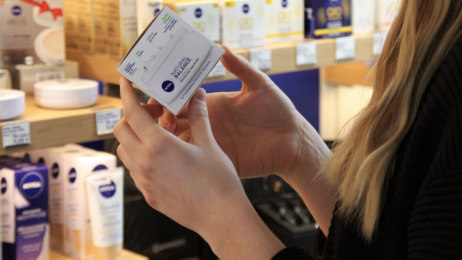 Fingers rubbing a cream