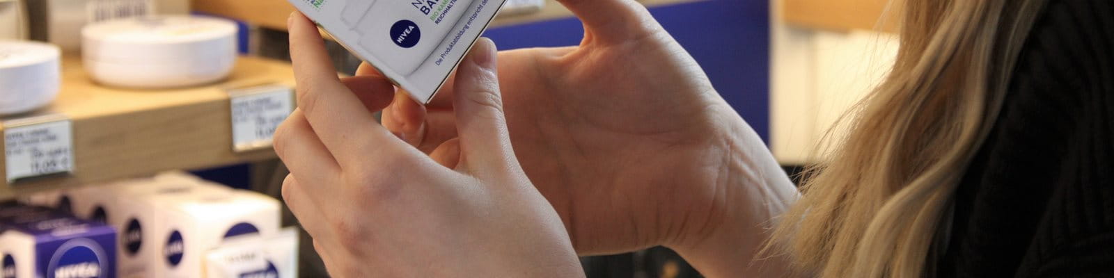 Fingers rubbing a cream