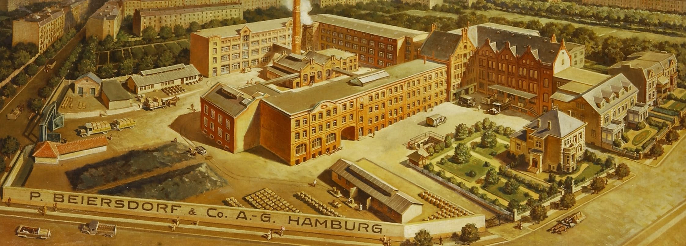 Illustrated aerial view of a historic industrial complex with red-brick factory buildings, a tall chimney and surrounding residential streets.