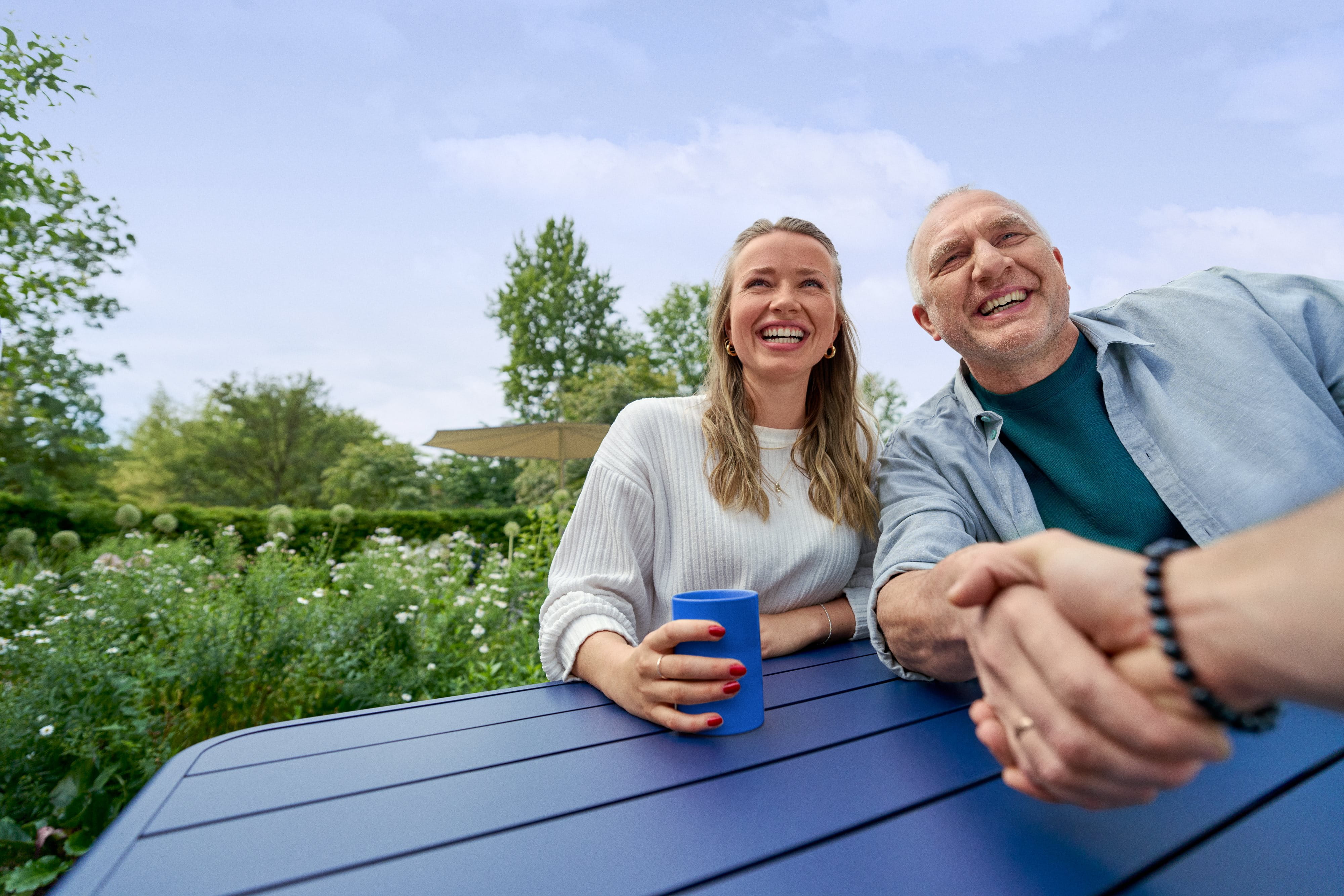 Beiersdorf employees connecting in an outdoor workspace, reflecting wellbeing, flexibility and an inclusive workplace culture.