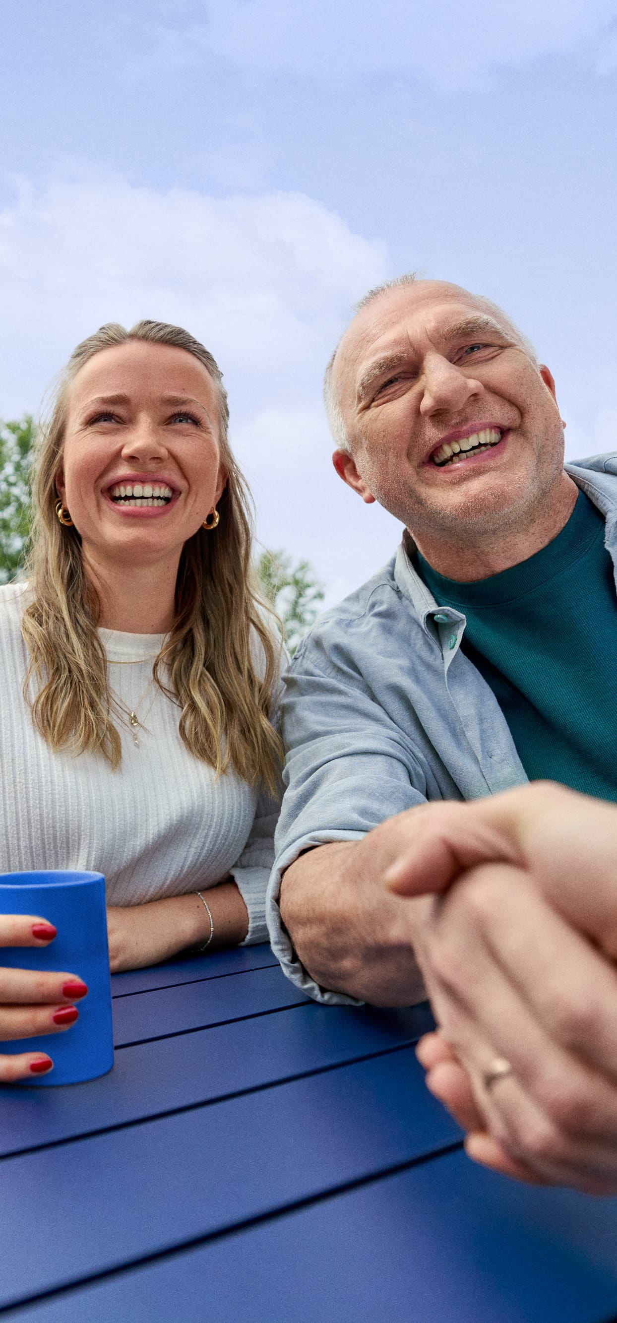 Beiersdorf employees connecting in an outdoor workspace, reflecting wellbeing, flexibility and an inclusive workplace culture.