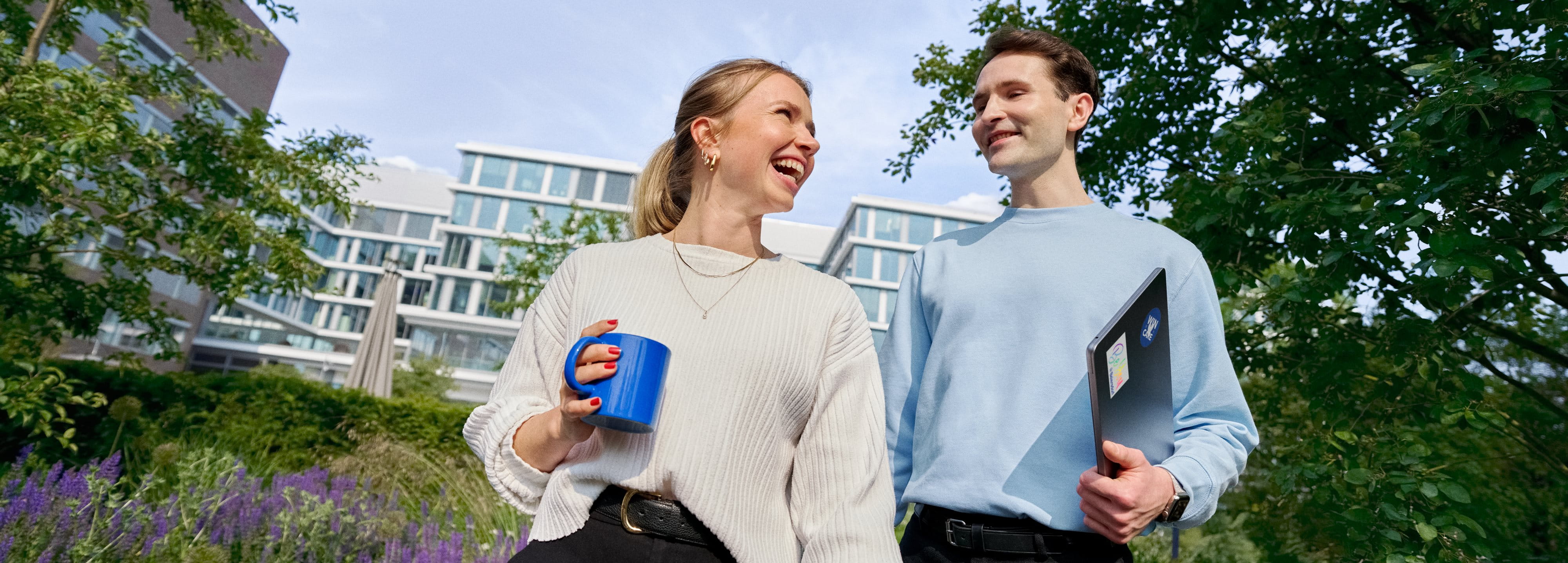 Beiersdorf employees connecting during a walk through the company campus, highlighting collaboration, workplace culture and flexible ways of working.