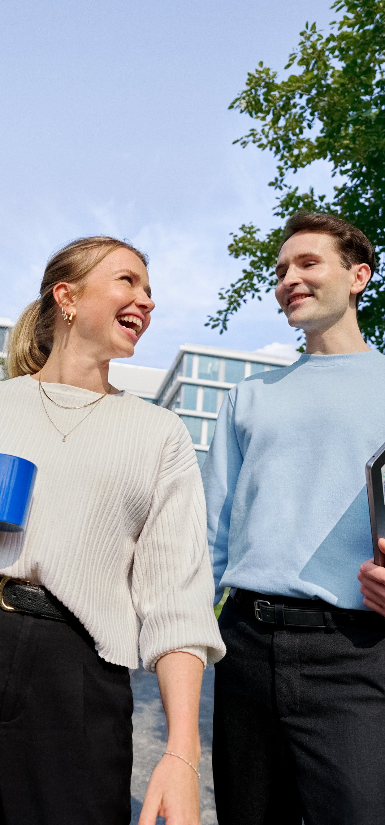 Beiersdorf employees connecting during a walk through the company campus, highlighting collaboration, workplace culture and flexible ways of working.