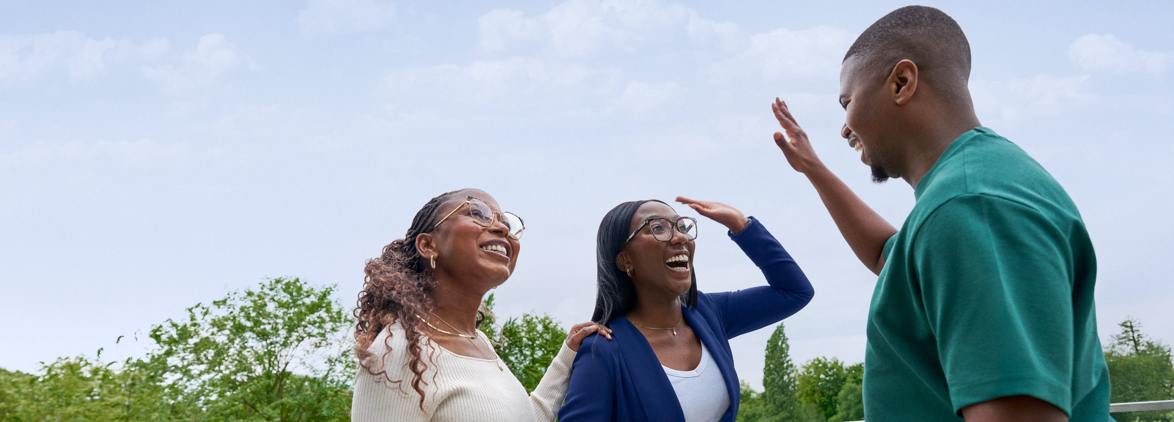 Beiersdorf employees celebrating a successful collaboration with a high five, representing teamwork and an inclusive work environment.